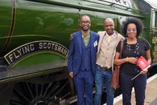 Molly Jackson, whose father Wilston Samuel Jackson became Britain’s first black train driver in 1962, and her nephews Eddie (left) and Wilston, with the Flying Scotsman at Doncaster Railway Station, celebrating her centenary by making a return to the city where she was built one hundred years ago, at an event hosted by City of Doncaster Council and London North Eastern Railway (LNER), which also turns 100 this year. Picture date: Friday June 30, 2023. PA Photo. In 1923, the steam locomotive was the first to be built at the Doncaster Works by the then newly formed LNER, costing £7,944 to build, and in its 40-years of service broke numerous world speed and distance records, including being the first locomotive to reach 100mph, and the first to circumnavigate the globe.