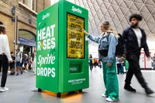 EDITORIAL USE ONLY Members of the public interact with prototype smart vending machine, as it is unveiled at London’s King’s Cross station by Sprite to bring to life their ‘Heat Happens’ campaign. Picture date: Wednesday July 12, 2023. PA Photo. The ‘smart vending machine’ uses live data to react to annoying moments of everyday commuter ‘heat’ - whether that’s ticket barrier bottlenecks, other people getting into your personal space or a train leaving 1 minute early - as the heat goes up, Sprite drops.