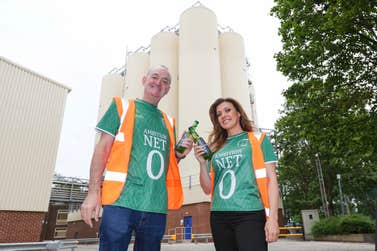 EDITORIAL USE ONLY Manchester United fan, Kym Marsh and Manchester City fan, Craig Cash put their differences aside and don green shirts during a tour of HEINEKEN UKÕs flagship Manchester brewery to celebrate a £25m investment into the brewery in support of the company's global net zero 2030 ambitions. Issue date: Sunday July 16, 2023. PA Photo.