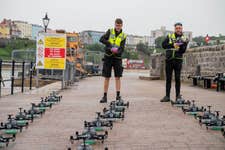 EDITORIAL USE ONLY Drone operators from FlightShows prepare for a drone display in Tenby, Wales, organised by the Ministry of Defence as part of their campaign to remind the public of the actions they should take to stay safe when using military land in the UK. Issue date: Friday August 18, 2023. PA Photo. ‘Respect the Range’ aims to raise awareness and understanding of the personal safety risks that the public face when accessing military land, including live firing, unexploded ordnance and fast-moving military vehicles. Picture credit should read: Adam Gasson/PA Wire