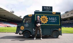 EDITORIAL USE ONLY Scottish Footballing legend, Christian Dailly and leading nutritionist, Sophia Linn pictured beside the Marks and Spencer Eat Well Foodtruck inside Hampden Scotlands National Football Stadium. Picture date: Thursday August 24, 2023. PA Photo.