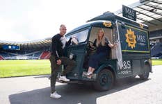 EDITORIAL USE ONLY Scottish Footballing legend, Christian Dailly and leading nutritionist, Sophia Linn pictured beside the Marks and Spencer Eat Well Foodtruck inside Hampden Scotlands National Football Stadium. Picture date: Thursday August 24, 2023.