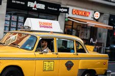 The DUNKIN' UK yellow cab, which features a photobooth inside, drives down Baker Street to announce the company's rapid expansion in the UK capital. Participants diverted to the cab from other coffee shops will receive a voucher for a year’s supply of DUNKIN’ coffee and donuts.