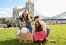 Lou (left) and Laureen (right) participate alongside Pug, Elio and Cocker Spaniel, Rocco in the Bark All About It protest at Potters Fields Park in London, hosted by pet food company Edgard and Cooper, calling for the UK government to implement new measures to ensure the wellbeing of our pets. Picture date: Wednesday September 13, 2023. PA Photo. The campaign calls on pet owners to sign a petition asking the government to update regulations, some of which haven’t changed for decades, around ingredient labelling, meat handling and transportation, and quality meat-content standards.