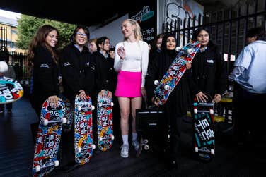 EDITORIAL USE ONLYStefani Nurding of Team Samsung Galaxy Skate signs boards for pupils of Holland Park School at an event announcing a new partnership between Samsung UK & Ireland and Skateboard GB, the governing body for Skateboarding in Great Britain. Picture date: Wednesday September 27, 2023. PA Photo. To inspire the next generation of skateboarding athletes, Samsung has brought together a team of pro skaters, led by Sky Brown, to capture their content with the new Samsung Galaxy Z Flip5. With Samsung’s support, Skateboard GB will use the funding to support ‘Skate More, Skate Better’, a campaign to provide more skateboarding coaching opportunities, maintain facilities, and supply elite athlete support.