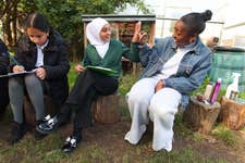 EDITORIAL USE ONLYCBBC Presenter, Mwaksy Mudenda interacts with pupil Fatma during a visit to Oakdale Junior School in London to launch ‘The Big Recycling Hunt’ as part of Recycle Week 2023, the UK’s largest national annual recycling campaign. Picture date: Tuesday October 17, 2023. PA Photo. Oakdale Junior School have been selected as the first-ever Recycling Youth Ambassadors and will help encourage children and families to find 'lost recyclables' that often find their way into the rubbish bin.