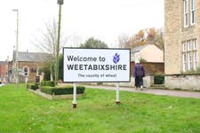 EDITORIAL USE ONLY ‘Welcome to Weetabixshire’ sign which has been erected in the Northamptonshire town of Burton Latimer to mark the new proposed county lines of Weetabixshire. Picture date: Tuesday November 14, 2023. PA Photo. The breakfast cereal brand is petitioning to create a new county comprising a 50-mile radius from their Mills in Burton Latimer where all the wheat for the cereal is grown.