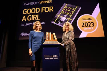 Lauren Fleshman, left, receives the 2023 William Hill Sports Book of the Year Award from chair Alyson Rudd. She picks up a £30,000 prize for her book, Good for a Girl My Life Running in a Man’s World