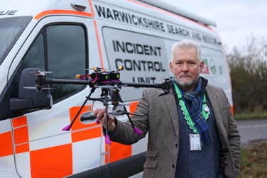 EMBARGOED TO 0001 MONDAY DECEMBER 11, 2023 EDITORIAL USE ONLY Head of Technical Trials Virgin Media O2, Dr. David Owens works with the Warwickshire Search and Rescue team to use a new 5G connected drone developed by Virgin Media O2 to help establish reliable communication in the most remote areas. Issue date: Monday December 11, 2023. PA Photo. The Warwickshire Search and Rescue team is the first team to trial the new technology on search missions in remote areas not served by traditional mobile networks