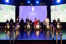 Survivors of the Holocaust and subsequent genocides light candles