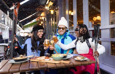 EDITORIAL USE ONLY (left to right) Athina, Alex, and Yewande dine at Côte Brasserie wearing full ski gear ahead of the restaurant chain introducing the offer of a free drink to anyone wearing slope-appropriate attire to celebrate its new Alpine menu. Issue date: Monday January 22, 2024. PA Photo. Côte Brasserie diners who order a main meal from the à la carte menu whilst wearing ski clothing or accessories, and say ‘après anything’ can take advantage of the limited time offer, valid from January 29 until February 29.