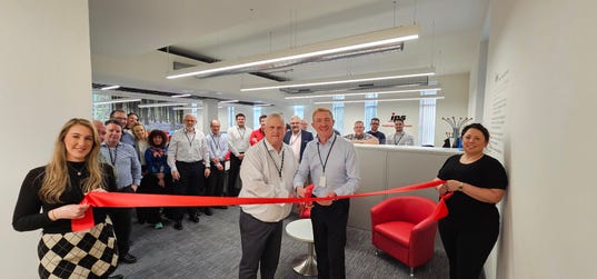 IPS UK Open a New Office in Manchester. Glen Slaymaker - IPS UK Director & Dennis Wareing - Director of Risk & Compliance cut the ribbon to open the new office. (Photo: Business Wire)