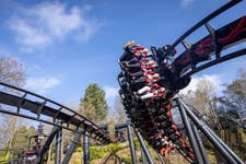 Fans experience one of the first rides of the day at the opening of Nemesis Reborn at Alton Towers Resort, as the 18-month project to transform the rollercoaster is completed. PA Photo. Fans queued from early this morning to experience the attraction which hits top speeds of 50mph and G Forces of 3.5.