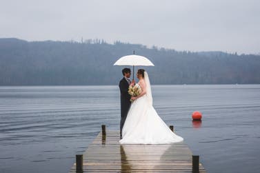 Louisa and Steven on their wedding day with the Bucklesbury English Wedding Umbrella