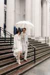 Theodora and husband, Thanos, on their wedding day with the Bucklesbury English Wedding Umbrella