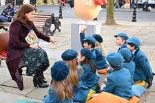 HRH Princess Eugenie reads to school children from Garden House School, at Elephant Family’s Little Egg Hunt, presented by Clarence Court, in Chelsea, London, an interactive large-scale egg hunt, with pieces designed by 12 leading designers. Picture date: Thursday March 21, 2024. PA Photo. Designers include Anya Hindmarch, Philip Colbert and Charlotte Colbert.
