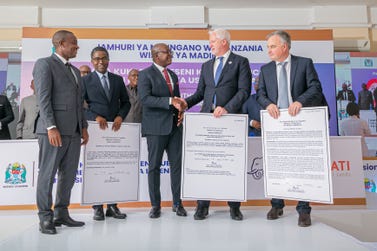 Lifezone’s CEO, Chris Showalter, receives the Kahama Refinery Licence with a handshake from the Minister of Minerals, Hon. Anthony Mavunde. (Photo: Business Wire)