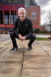 EDITORIAL USE ONLY Ian Rush unveils the Mr Muscle Walk of Fame in front of Liverpool Football Club, created using reverse graffiti to celebrate the 12,848 fans who have contributed to sustainability efforts at Anfield. Issue date: Monday April 29, 2024. PA Photo. Mr Muscle, a brand of SC Johnson’s who is the official sustainability partner of Liverpool Football Club, has reverse grafitted 12,848 fan names on Rockfield Road to represent the 12,848 plastic bottles that have been recycled every match day on average.