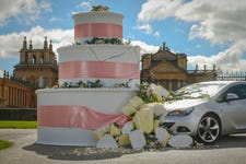 LONDON, UK - 24 APRIL, 2024 A car crashes into a giant wedding cake outside Blenheim Palace - the UK’s most Instagramed wedding venue, as Direct Line raises awareness of drink driving the morning after wedding festivities. Find out more at www.directline.com