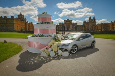 LONDON, UK - 24 APRIL, 2024 A car crashes into a giant wedding cake outside Blenheim Palace - the UK’s most Instagramed wedding venue, as Direct Line raises awareness of drink driving the morning after wedding festivities. Find out more at www.directline.com
