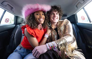 EDITORIAL USE ONLY Andreia and Alex display their bracelets outside Wembley Stadium, London as Uber releases limited edition bespoke, colour-coded friendship bracelets in Ubers across Edinburgh, Liverpool, Cardiff and London to celebrate Taylor Swift’s The Era’s tour coming to the UK. Issue date: Wednesday May 1, 2024. PA Photo. The colour-coded friendship bracelets will be available to Uber riders to share and swap at concerts during this summer of concerts, with 200 of the bracelets also including a special code that offers £20 off Uber Reserve trips.