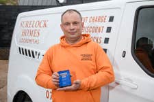 Matt Triboulliard, Owner of Surelock Homes, with the trophy for Simply Business’ Britain’s Best Small Business Name 2024 competition.