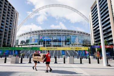 EDITORIAL USE ONLY Bradley Lemaire (left) and Callum Barton (right) deliver a sofa owned by competition winners, Sarah Carter and Mark Slaughter to Wembley Stadium in London, ahead of tonight's UEFA Champions League Final, as part of the ‘No Walkers, No Game’ competition by Walkers. Issue date: Saturday June 1, 2024. PA Photo. The competition winners from Portsmouth will watch the sold-out game from ‘the best seat in the house’ in a VIP box with a guest appearance from longstanding Walkers’ ambassador, Gary Lineker.