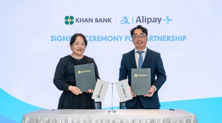 Ms. Erdenedelger Bavlai, First Deputy CEO of Khan Bank (left) and Mr. Frank Piao, Country Manager, Alipay+ Mongolia officiated the partnership ceremony at Khan Bank HQ, Mongolia. (Photo: Business Wire)