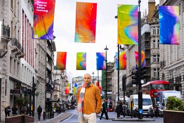 Artist and RA alumni Adham Faramawy at the unveiling of their collection of new flags titled ‘Rainbow Flags’ at Piccadilly in London, commissioned by Art of London and Art in Mayfair in partnership with the Royal Academy of Arts. Picture date: Monday June 10, 2024. PA Photo. The innovative artwork features an array of vibrant colours, where the edges blur and fold into each other to symbolise the diversity of LGBTQ+ identities.