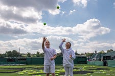 WaterAid and the Wimbledon Foundation took over a tennis court at The All England Lawn Tennis Club, to create a giant mosaic. The image is of a young boy and his mother enjoying clean water and is created entirely from tennis nets, balls and rackets
