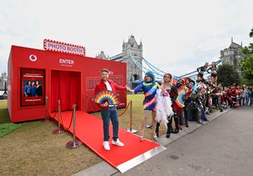 EDITORIAL USE ONLY Roman Kemp at the UK’s biggest photo booth, part of The Nation’s Network Campaign, launched by Vodafone. Wednesday June 11, 2024. PA Photo. The booth will provide the nation’s networks with profile pics for their group chats, social networks and communities captured by celebrity photographer Samir Hussein at Potters Field Park, London. The launch follows research showing that the average adult is now part of 83 active group chats and over a quarter of people communicate with friends, family and work colleagues through their group chats more than one-on-one messaging.