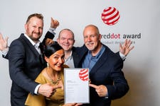 (From left to right): Mark Williams, Perla Munhoz, Wayne Stant, and Paul Wright of Traka pose with the 2024 Red Dot Award for Product Design. The award was presented to Traka for its Traka Touch Pro line of intelligent key cabinets. (Photo: Business Wire)