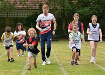 EDITORIAL USE ONLY ParalympicsGB powerlifter, Zoe Newson (second left) and Team GB Olympic race walker, Tom Bosworth (centre) participate in the egg and spoon race alongside pupils from Stutton Church of England Primary School in Ipswich, Suffolk during a ÔPositive Energy Sports DayÕ, organised in partnership between British Gas and Heart Radio. Issue date: Tuesday July 2, 2024. PA Photo. Earlier this month, British Gas partnered with Heart Radio to run a radio competition, giving UK primary school pupils the opportunity to win a sports day for their school with Team GB and ParalympicsGB athletes at the three winning schools.