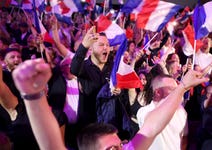 Supporters of the Rassemblement National (RN) react in Henin-Beaumont in northern France with jubilation to the announcement of the results of the first round of the parliamentary elections on June 30. The far-right RN became the strongest force and hopes to gain a majority in parliament after the run-off elections on July 7.