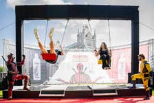 EDITORIAL USE ONLY(Left to right) BBC’s Race Across The World contestants James and Betty Mukherjee, ‘get wet and get wild’ on the waterfall swing, unveiled by Actiph Water at London's Potters Fields Park today, in celebration of their partnership with Marvel Studios’ Deadpool & Wolverine. Picture date: Wednesday July 17, 2024.