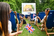 EDITORIAL USE ONLY Fans at Mayfair’s official Team GB Fanzone in Grosvenor Square, which screened the Olympics opening ceremony this evening. Picture date: Friday July 26, 2024. PA Photo. Running until Sunday August 11, the free outdoor event will show the Paris 2024 Olympic Games on a huge outdoor screen each day and include a lineup of food and drink stalls, al fresco dining areas and family activities.