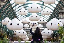 EDITORIAL USE ONLY “Little Cloud World”, a new large-scale installation by Los Angeles-based artist duo ‘FriendsWithYou’, is unveiled in Covent Garden’s Market Building. Picture date: Wednesday July 31, 2024. PA Photo. Over 40 floating clouds, each measuring over 4ft in height, fill the South Hall, creating a ‘portal into a happy place’.