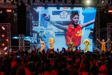 Nymphia Wind, a Taiwanese drag queen and winner of RuPaul's Drag Race, was overcome with emotion as Lin's photo and the news of her gold medal appeared on the LED screen. (Photo: Business Wire)