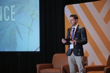 Fluence principal scientist Dr. Davis Hawley speaks at the 6th PHOTOx Summit (Photo: Business Wire)