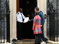 EDITORIAL USE ONLY JJ Chalmers and environmental action non-governmental organisation (NGO) WRAP CEO Harriet Lamb visit 10 Downing Street for the launch of UK’s annual Recycle Week (October 14th - 20th) with an open letter encouraging more households to reduce the number of recyclable items they send to landfill. Picture Date: Monday October 14, 2024. PA Photo. Aerosols, yoghurt pots, perfume bottles, plastic trigger sprays and toilet roll tubes make up the nine billion items each year that are discarded without being recycled. Although nine out of ten people recycle, nearly eight out of ten still bin recyclable items, inspiring the creation of their life-size figures to tackle declining recycling rates.