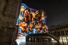 EDITORIAL USE ONLYA preview of a specially commissioned AI artwork from Ouchhh Studio, made using cognitive technology to visualise brainwaves of the Arts & Film ‘Game Changers’ is projected across the façade of the V&A’s Exhibition Road Courtyard building in London, ahead of it being publicly unveiled tomorrow night as part of The National Lottery’s 30th birthday celebrations. Picture date: Thursday October 31, 2024. PA Photo. Thanks to National Lottery players, more than £30 million is raised every week for good causes, and this is the final of four unique activities taking place across the UK in the build-up to celebrating The National Lottery’s 30th Birthday on November 19.