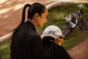 Colombian BMX cyclist Mariana Pajón signs the Relaxation Clause (Photo: Business Wire)