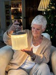 Dame Judi Dench with one of ShelterBox's virtual gifts - a solar light