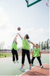 Students playing basketball at one of the Nike Grind courts in China. (Photo: Business Wire)