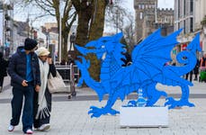 EDITORIAL USE ONLY A blue dragon is unveiled in Cardiff to announce 'Bounty' as the Welsh capital's top choice of Celebrations, as part of a campaign to get the UK debating its favourite chocolate. Issue Date: Friday December 13, 2024. PA Photo. As part of the #MyFavourite Celebrations Christmas Campaign, Celebrations is inviting the public to have their say in a nationwide debate. Research by Celebrations shows that a quarter of Cardiffians rank Bounty as the city's favourite. To honour this, they also attempted to "correct" the spelling of the word “Bownti” to "Bounty" in the Welsh language dictionary, but it got rejected.