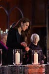 The Princess of Wales lights a candle at the national Holocaust Memorial Day Ceremony