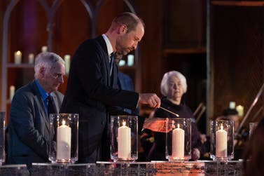 The Prince of Wales lights a candle at the national Holocaust Memorial Day Ceremony