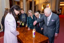 His Majesty The King lit a candle with Holocaust survivor, Manfred Goldberg, at Buckingham Palace in support of 'Light the Darkness'