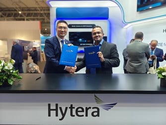 Mr. Tony Wang (left) and Mr. Naadir Hassan (right) shake hands after signing the MoU (Photo: Business Wire)