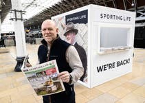 EDITORIAL USE ONLY Mike Tindall hands out copies of Sporting Life to racing enthusiasts at Paddington Station, London in celebration of the start of the Cheltenham Festival. Picture Date: Tuesday, March 11, 2025.